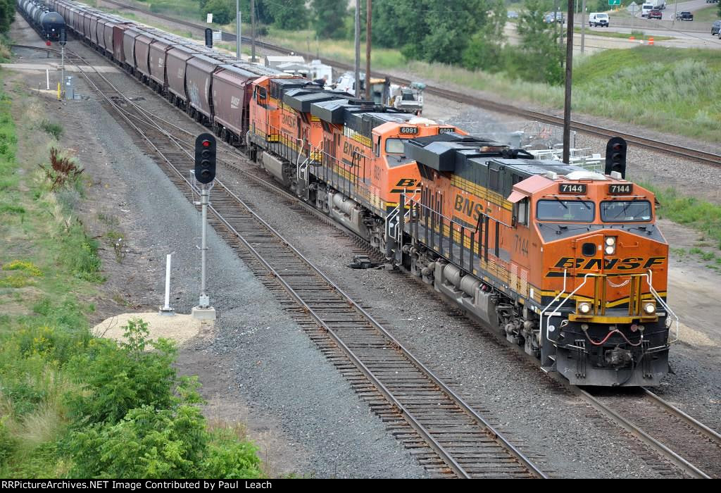 Grain train rolls east